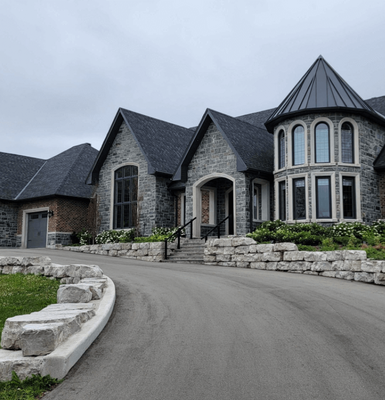 Photo of Stone & Brick Home With Limestone Surrounds